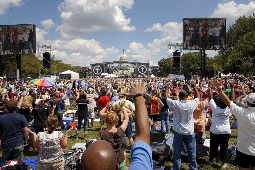 Photographs by Rod Lamkey Jr./The Washington Times
A crowd estimated at 50,000 takes part in TheCall DC, a Christian rock concert and day of prayer and fasting, Saturday on the National Mall.