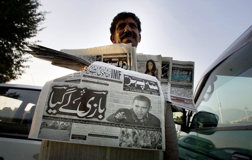 ASSOCIATED PRESS
President-elect Barack Obama's victory is headline news in papers Abdul Raheem is selling Nov. 5 in Islamabad.