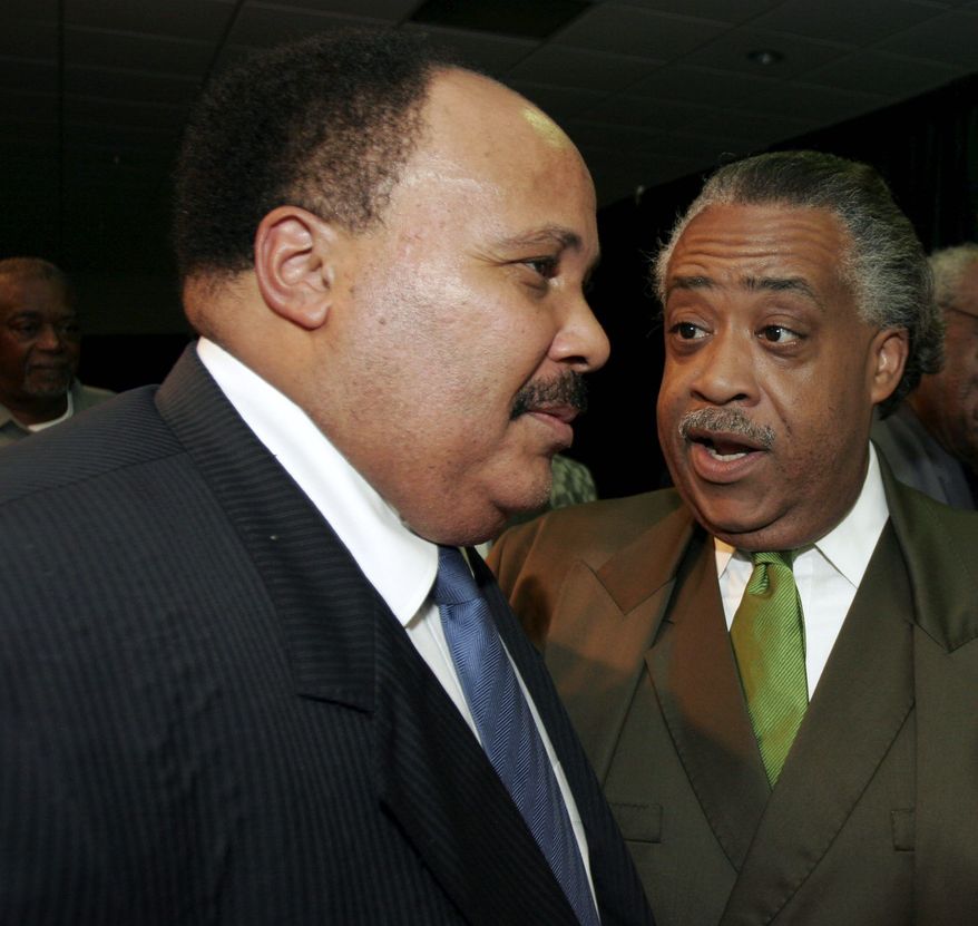 Martin Luther King III (left) and the Rev. Al Sharpton converse after their addresses to the Southern Christian Leadership Conference on Monday, July 31, 2006, in Dayton, Ohio. (AP Photo/David Kohl)