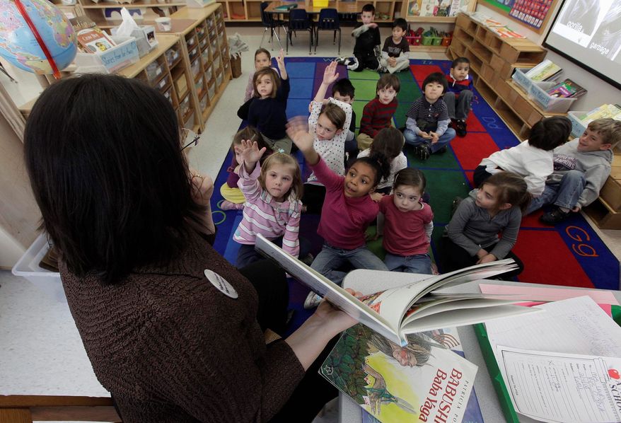 AP *FILE**
Kindergarten students listen to a story at Daniel Warren Elementary School in Mamaroneck, N.Y.