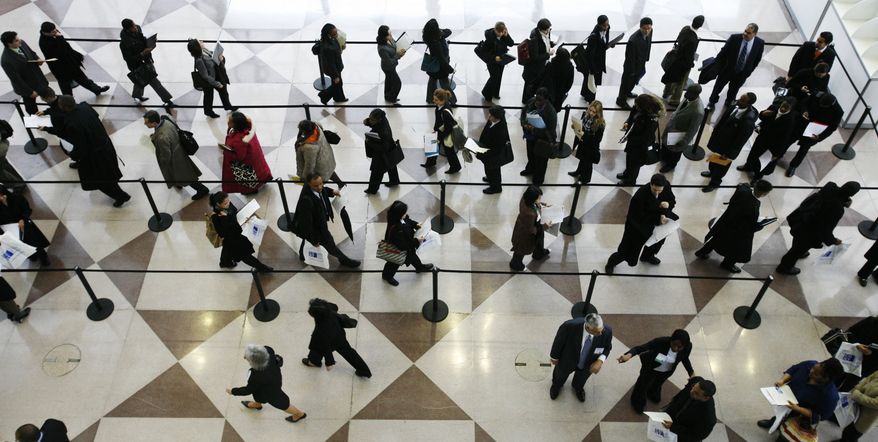 **FILE** A line of job applicants snakes through a ropeline to attend the CUNY Big Apple Job Fair Friday, March 20, 2009 in New York. The fair, for students and alumni of the City University of New York, attracts several thousand college-educated applicants. New jobless claims fell more than expected last week, but continuing claims set a new record for the eighth straight week and few economists expect the labor market to improve anytime soon. (AP Photo/Mark Lennihan)