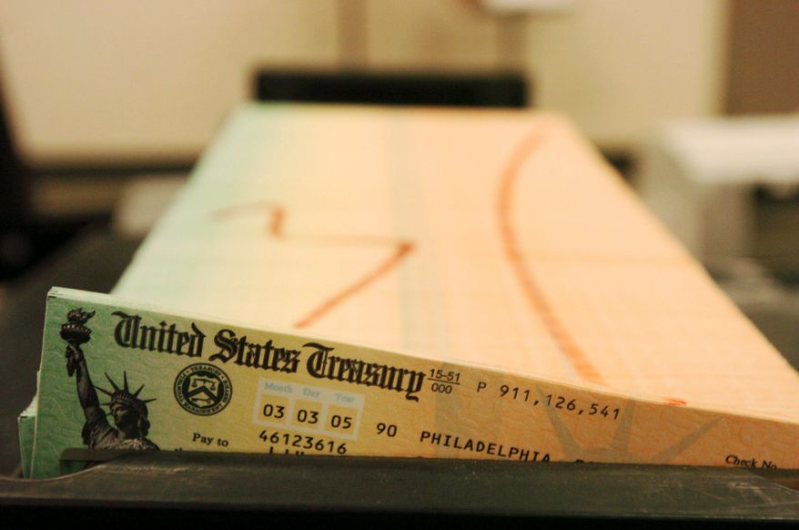 ** FILE ** Social Security checks are printed. (Associated Press)
