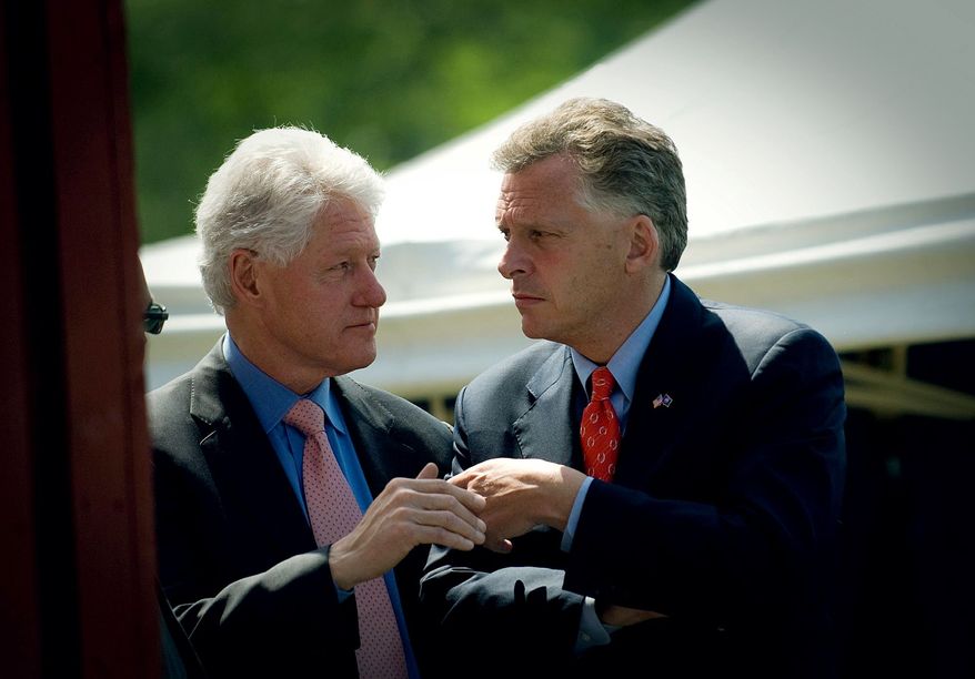 ** FILE ** Virginia Democratic gubernatorial candidate Terry McAuliffe (right) confers with former President Bill Clinton at a campaign rally in Herndon, Va., in 2009. (The Washington Times)