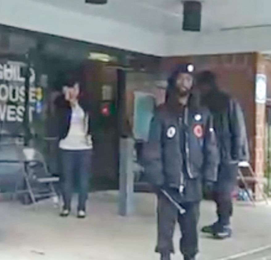 **FILE** Members of New Black Panther Party carrying nightsticks stand outside a Philadelphia polling place. (ElectionJournal.org)