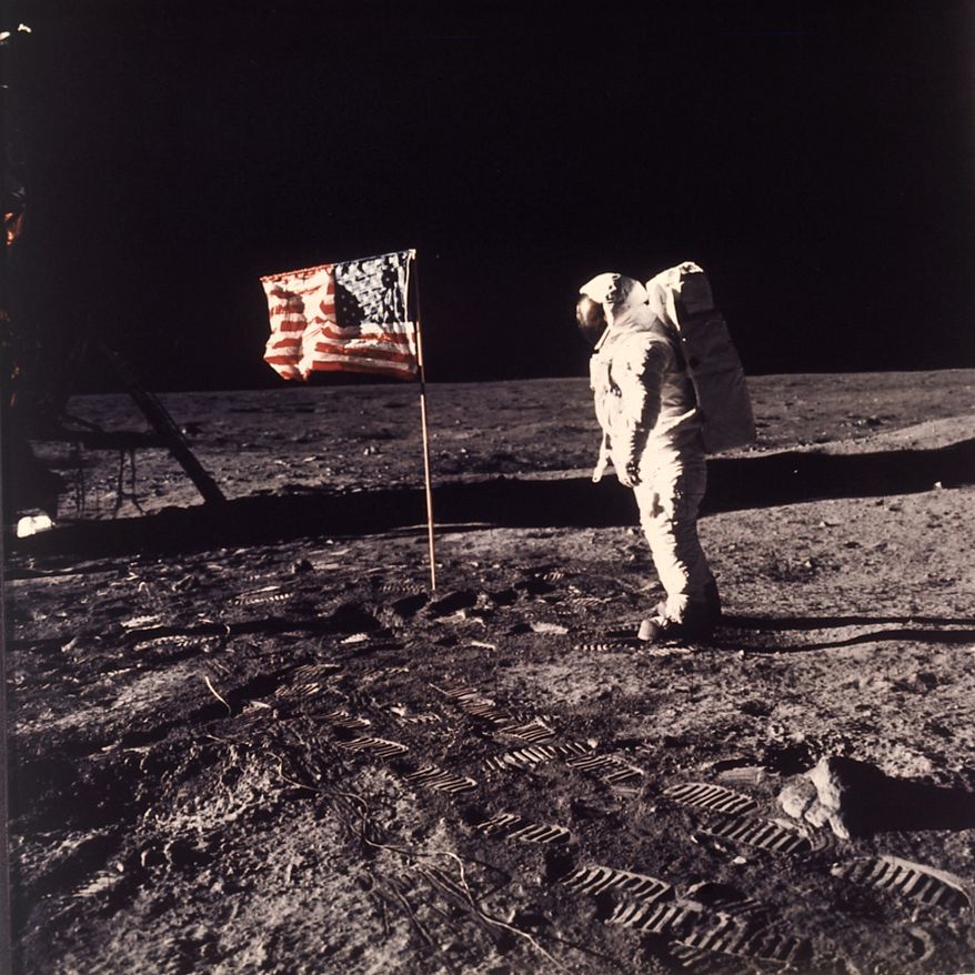 ** FILE ** In this July 20, 1969, photo, astronaut Edwin E. "Buzz" Aldrin Jr. poses for a photograph beside the U.S. flag deployed on the moon during the Apollo 11 mission. (AP Photo/Neil Armstrong, NASA)
