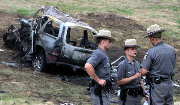 ** FILE ** New York state troopers investigate a fatal accident in which eight people were killed July 26 in Hawthorne, N.Y. A medical examiner found that the driver traveling the wrong way on the highway was legally drunk and high on marijuana.