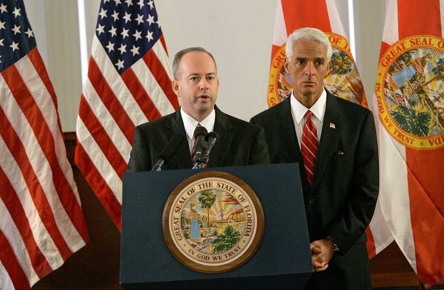 George LeMieux, left, former chief of staff to Gov. Charlie Crist, right, answers questions from the media after being named to replace U. S. Senator Mel Martinez, Friday, Aug. 28, 2009, in Tallahassee, Fla. (AP Photo/Phil Coale)