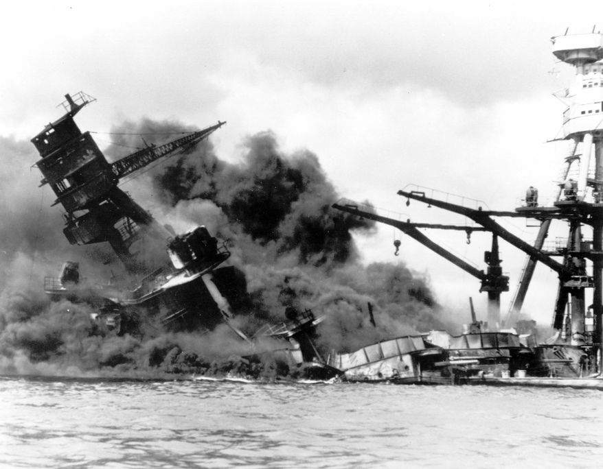 associated press
The battleship USS Arizona belches smoke as it topples over into the sea during a Japanese surprise attack on Pearl Harbor, Hawaii, on Dec. 7, 1941.