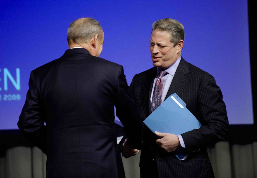 Former U.S. vice president and president candidate, Al Gore, right, shakes hands with UN climate head, Yvo de Boer, before speaking, at the Climate Summit, in Copenhagen Tuesday, Dec. 15, 2009. (AP Photo/Tariq Mikkel Khan/Polfoto)