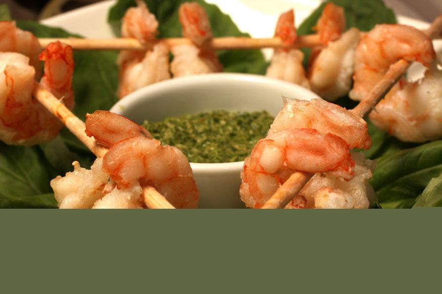 ** FILE ** This Dec. 12, 2009, file photo shows grilled shrimp with Thai-style pesto for dipping. (Associated Press)