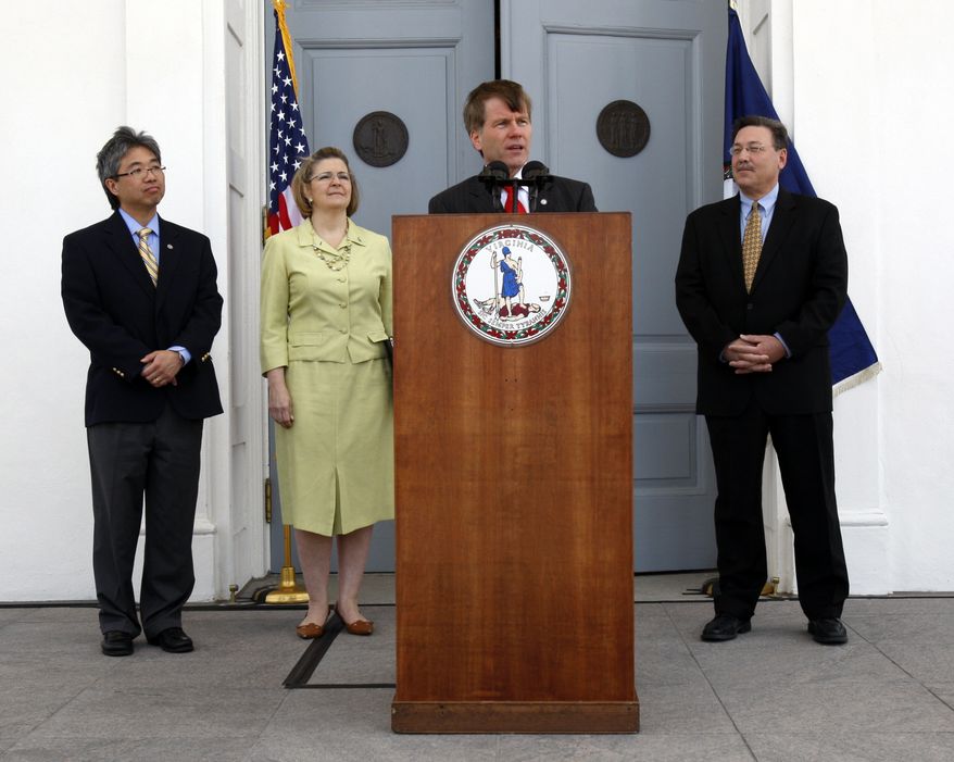 **FILE** Virginia Gov. Robert F. McDonnell (at podium) addresses President Obama's announcement of offshore oil and gas exploration as (from left) Virginia Secretary of Commerce and Trade Jim Cheng, Deputy Secretary of Natural Resources Maureen Matsen and Secretary of Natural Resources Dout Domenech look on at the Capitol in Richmond on Wednesday, March 31, 2010. (AP Photo/Richmond Times-Dispatch, Bob Brown)