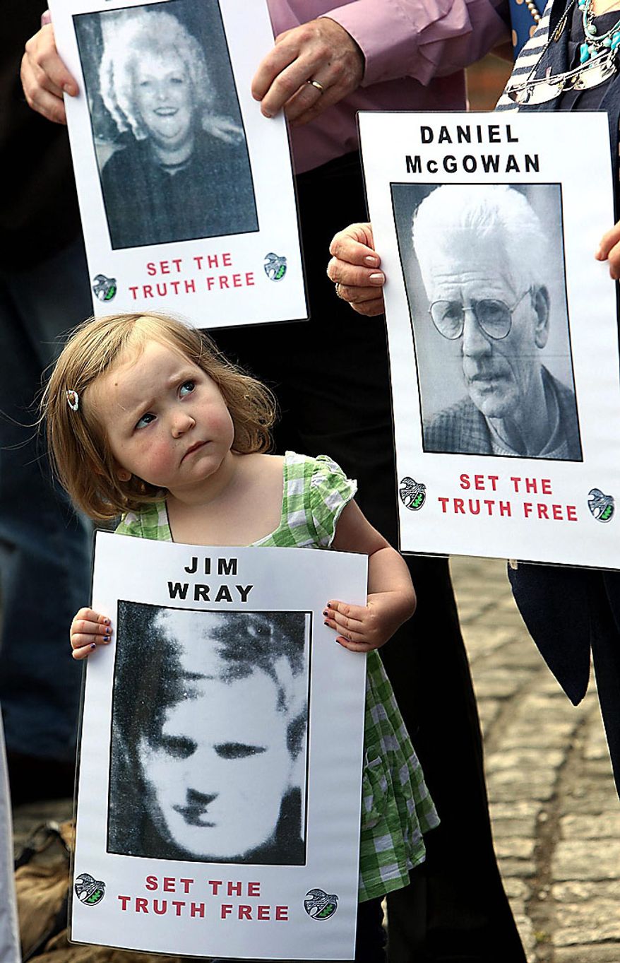 Megan Bradley, 3, great-niece of Jim Wray, gathers in Londonderry, Northern Ireland, on Tuesday, June 15, 2010, with other relatives of those shot dead on Bloody Sunday in 1972. The British government is releasing the long-awaited Saville Report, which investigated Bloody Sunday, on which 13 Catholic demonstrators were killed by British troops. The investigation began in 1998 and became the most expensive in British legal history as it gathered evidence from 2,500 witnesses, including troops who opened fire that day. (AP Photo/Paul Faith/PA Wire)