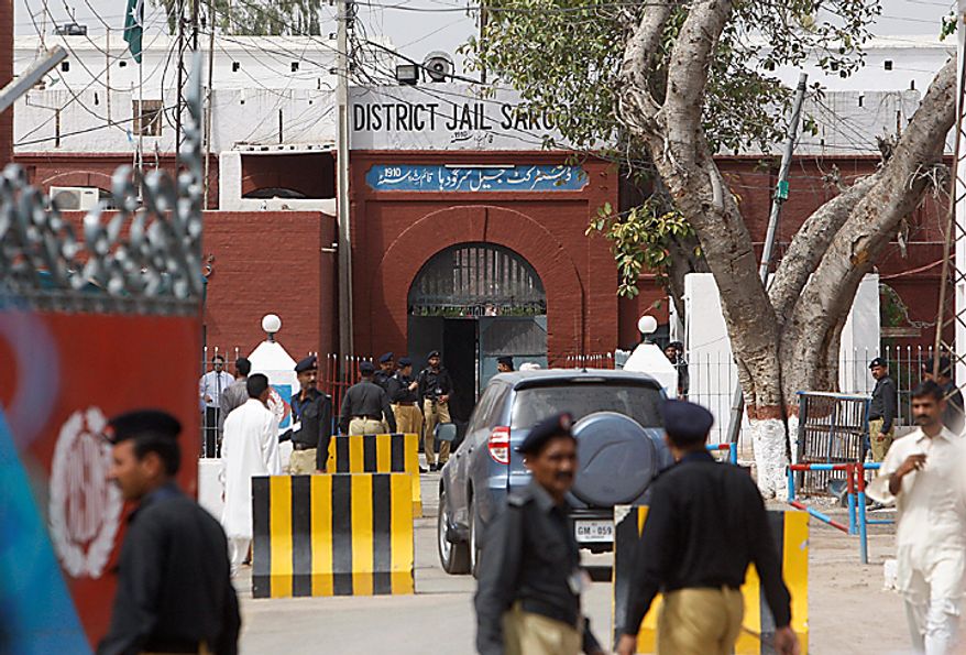 Pakistani police officers stand guard outside the district jail, where five young American Muslims from the Washington, D.C. area who were arrested in Pakistan in December, are being held in Sargodha, Pakistan, Thursday, June 24, 2010. The five American men were convicted Thursday on terror charges by a Pakistan court and sentenced to 15 years in prison each, a prosecutor said. The judge handed down two prison terms for each man, one for 10 years and the other for five, said deputy prosecutor Rana Bakhtiar. (AP Photo/Dita Alangkara)