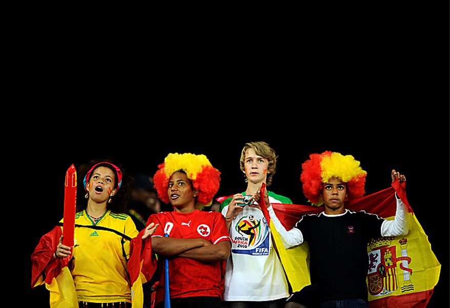 Spain soccer fans wait for the start of the World Cup semifinal soccer match between Germany and Spain at the stadium in Durban, South Africa, Wednesday, July 7, 2010. (AP Photo/Daniel Ochoa de Olza)