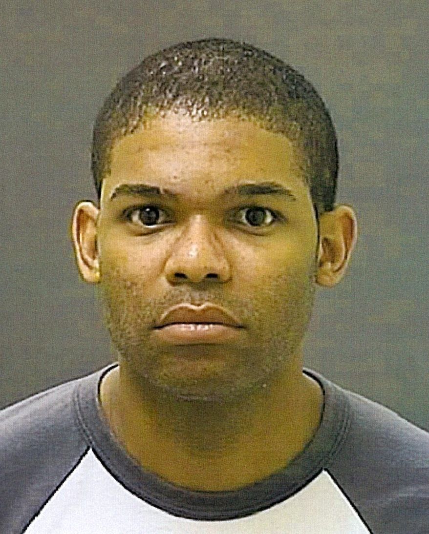 An undated photo provided by the Maryland Dept. of Public Safety & Correctional Services of Officer Gahiji Ajamu Tshamba, who has been charged with first-degree murder in the off-duty shooting of an unarmed man outside a Baltimore nightclub. Officer Gahiji A. Tshamba, 36, turned himself in early Sunday, June 14, 2010 more than a day after he was charged in a warrant with first-degree murder in the death of 32-year-old Tyrone Brown. (AP Photo/Baltimore Police Dept.)