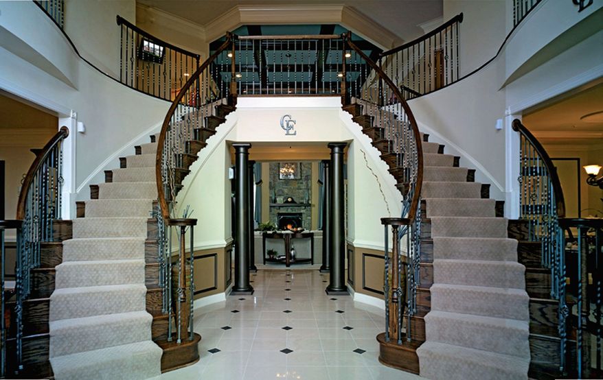 The Hampton model at Cheltenham Estates features a two-story foyer with dual staircases and a central hall.