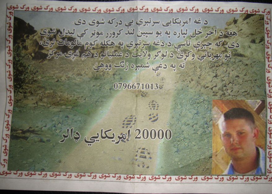 A leaflet distributed by the U.S. military to civilians in Logar province, east of Kabul, Afghanistan, on Sunday, July 25, 2010, shows a missing U.S. Navy sailor with an offer of a $20,000 reward for information on his whereabouts. The leaflet reads: "This American troop is missing. He was last seen in a white Land Cruiser vehicle. If you have any information about this solider, kindly contact the Logar Joint Coordination Center." U.S. and NATO officials confirmed that two American Navy personnel went missing Friday in the eastern province of Logar after an armored sport utility vehicle was seen driving into a Taliban-held area. (AP Photo)