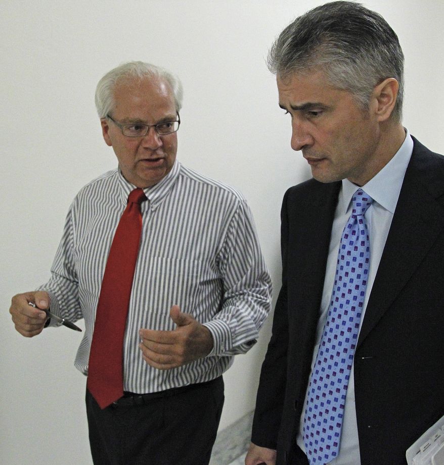 In this photo taken June 16, 2010, John Kausner of Clarence Center, N.Y., left, who's 24-year-old daughter Ellyce died in the crash of Continental Connection Flight 3407 in Feb. 2009, talks to Jeffrey Smisek, right, Continental Airlines President and CEO, to request his support for new airline safety provisions outside a congressional committee hearing on Capitol Hill in Washington. Congress is on the verge of passing far-reaching airline safety legislation, and a lot of the credit goes to the families and friends of the 50 people died in the Flight 3407 crash more than a year ago. (AP Photo/Haraz N. Ghanbari)