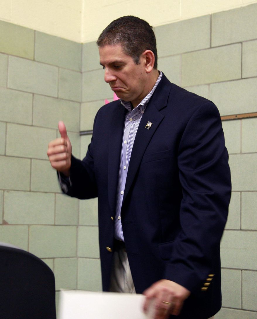 Democratic gubernatorial candidate Virg Bernero gives a thumbs up after voting in the party primary Tuesday in Lansing, Mich. (AP Photo)