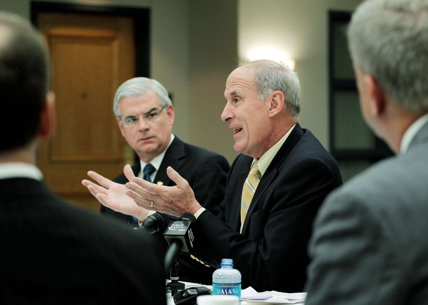 ASSOCIATED PRESS
Dan Coats, Republican nominee for U.S. Senate (right center), speaks with health care professionals during a roundtable discussion on health care at St. Francis Hospital in Indianapolis on Tuesday.