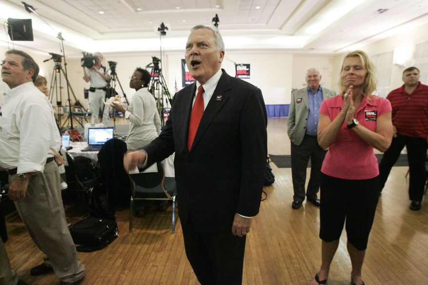 ASSOCIATED PRESS Georgia gubernatorial candidate Nathan Deal reacts while watching polling results as they are broadcast during a republican primary runoff election gathering Tuesday, August, 10, 2010, in Gainesville, Ga.