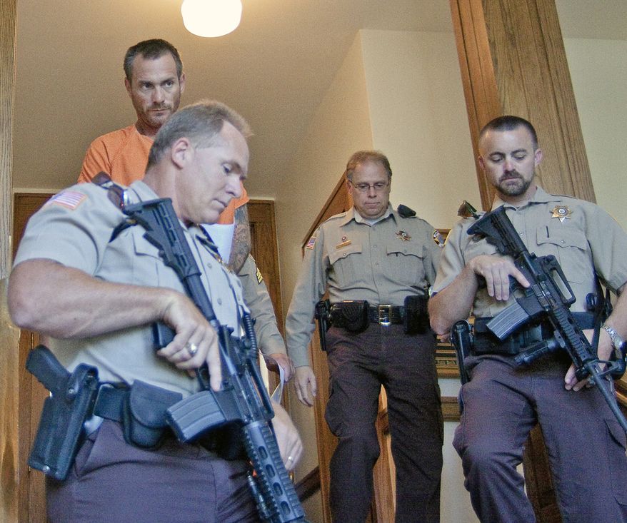 Escaped convict Tracy Province leaves the Park County Courthouse in Cody, Wyo., after waiving his right to contest extradition to Arizona on Tuesday, Aug. 10, 2010. (AP Photo/Cody Enterprise, Scott Salisbury)