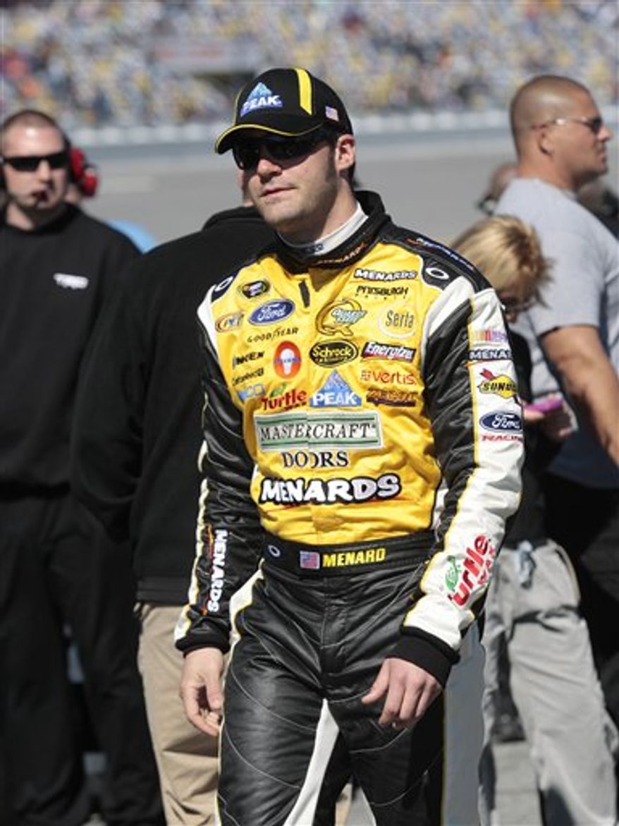 FILE - This Feb. 6, 2010, file photo shows NASCAR driver Paul Menard waiting to qualify for the Daytona 500 at the Daytona International Speedway in Daytona Beach, Fla. Paul Menard is moving to Richard Childress Racing next season, and bringing with him the sponsorship that organization needs to be a four-car team. Menard will be sponsored at RCR by his father's Wisconsin-based home improvement company. (AP Photo/Dave Martin, File)