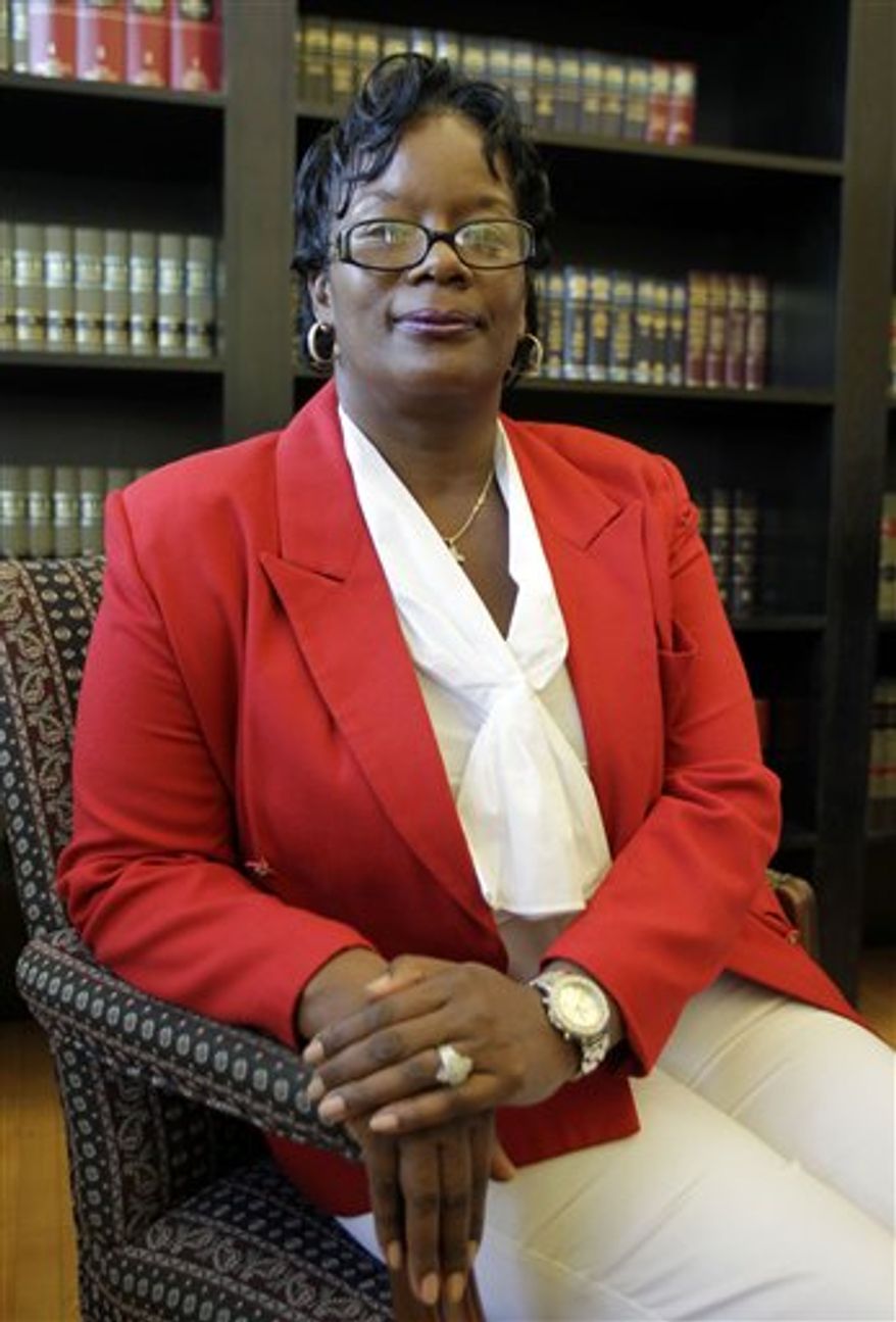 In this July 30, 2010 photo, attorney Denise LaRue, right, and her client Brenda Chaney pose in her law office in Indianapolis. Chaney worked in a Plainfield, Ind., nursing home that issued her an assignment sheet including a daily reminder that one woman in her unit "Prefers No Black CNAs." Nursing home residents have the right to choose who's going to take care of them, except when those choices are based on color, 7th U.S. Circuit Court of Appeals ruled in Chaney's case in July. (AP Photo/Michael Conroy)