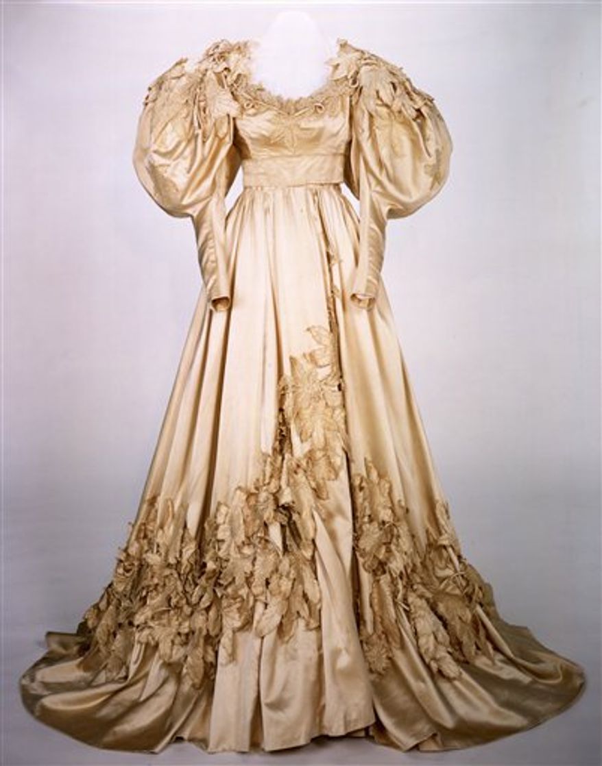 FILE - This 1939 photo provided Aug. 10, 2010, by the Harry Ransom Center at the University of Texas in Austin shows Vivien Leigh, as Scarlett O'Hara, wearing a burgundy ball gown, and co-star Clark Gable in Gone With The Wind. Ransom Center officials announced Tuesday, Aug. 31, 2010, they had met their $30,000 fundraising goal to pay for restoring five of Scarlett O'Hara's gowns for an exhibit to mark the 1939 movie's 75th anniversary in 2014. The center said contributions came from more than 600 people in 44 states and 13 countries. (AP Photo/The Harry Ransom Center at the University of Texas in Austin) NO SALES