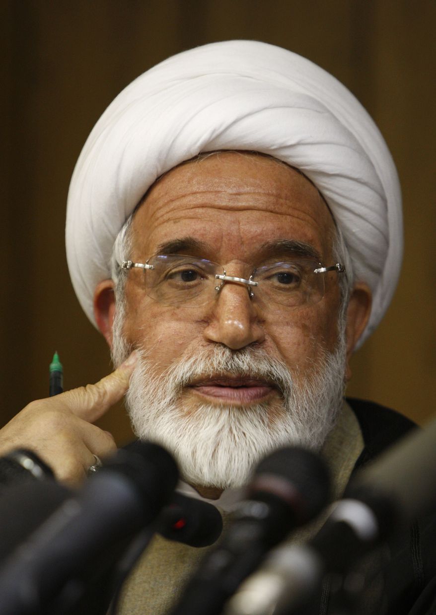 In this June 9, 2009, file photo, Iranian opposition leader Mahdi Karroubi attends a press conference in Tehran. Pro-government militiamen attacked Mr. Karroubi's home with homemade bombs and beat one of his bodyguards unconscious Thursday, Sept. 2, 2010, an opposition website reported, in an apparent attempt to keep him from attending the annual state-sponsored rally known as Quds Day, or Jerusalem Day. (AP Photo/Vahid Salemi, File)