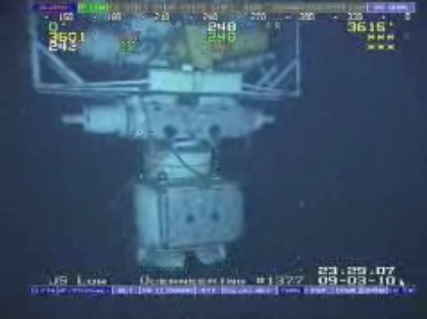 This image taken from video provided by BP PLC shows the blowout preventer that failed to stop oil from spewing into the Gulf of Mexico being raised to the surface. (AP Photo/BP PLC)