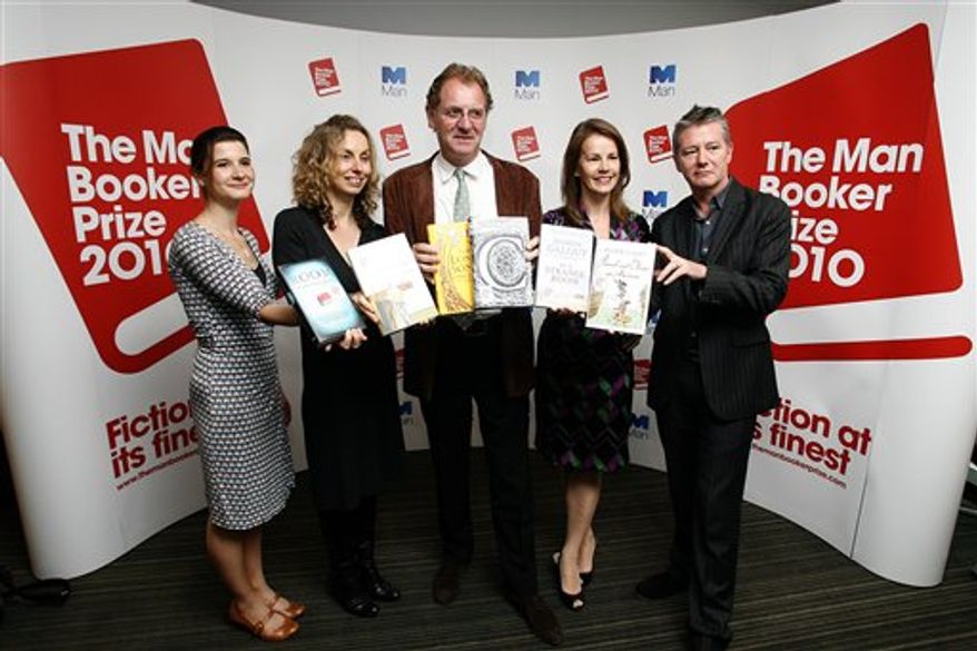 Judges, from left, Rosie Blau, Literary Editor of the Financial Times, Frances Wilson, writer, Chair Andrew Motion, Professor of Creative Writing at Royal Holloway College, Deborah Bull, Creative Director of the Royal Opera House, and Tom Sutcliffe, author, broadcaster and journalist, pose for photographers with short listed books during a press conference for the 2010 Man Booker Prize for Fiction in London, Tuesday, Sept. 7, 2010. The judges have Tuesday announced the short listed books, which are Peter Carey 'Parrot and Olivier in America', Emma Donoghue 'Room', Damon Galgut 'In a Strange Room', Howard Jacobson 'The Finkler Question', Andrea Levy 'The Long Song', and Tom McCarthy 'C'.(AP Photo/Akira Suemori)