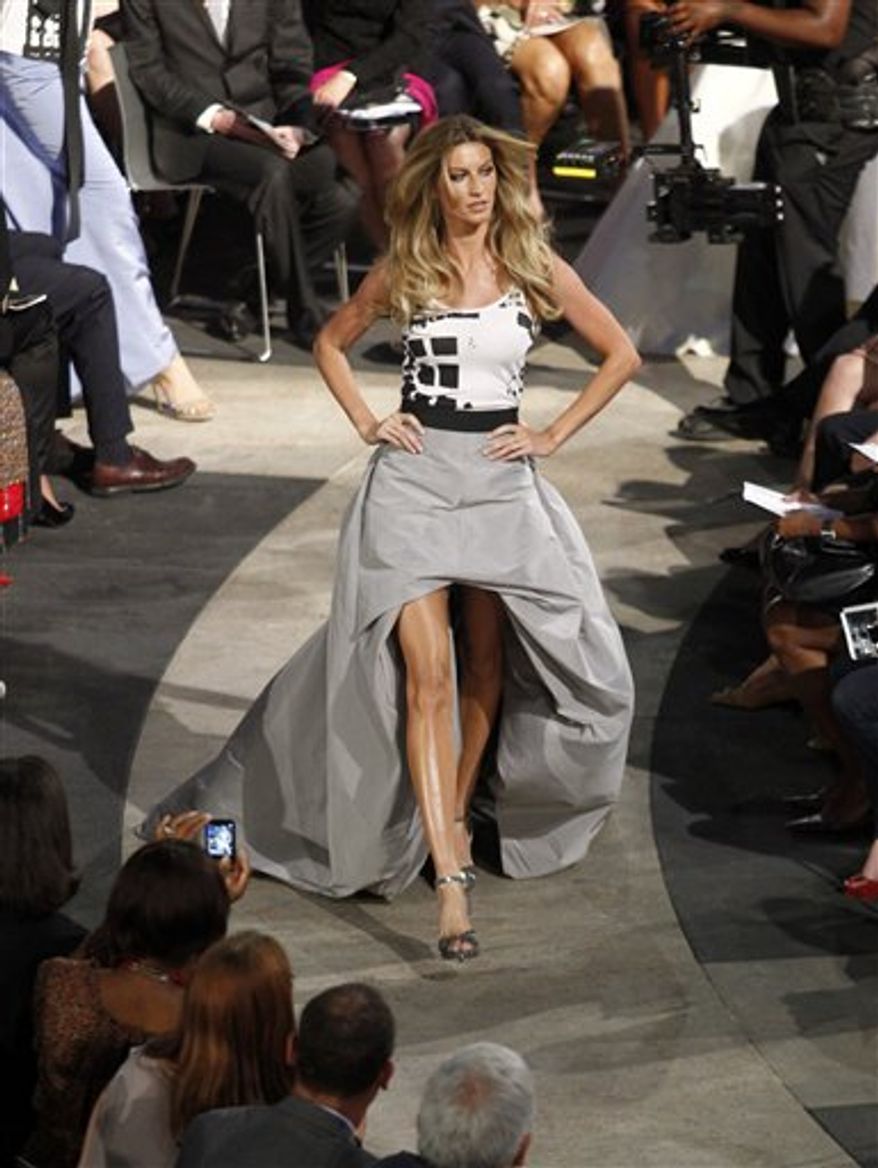 Model Gisele Bundchen walks the runway during "Fashion's Night Out: The Show" at Lincoln Center in New York on Tuesday, Sept. 7, 2010. (AP Photo/Peter Kramer)