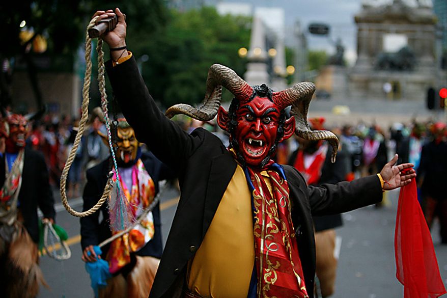 Dancers perform during the bicentennial parade in Mexico City, Wednesday Sept. 15, 2010. Mexico celebrates the 200th anniversary of its 1810 independence uprising. (AP Photo/Miguel Tovar)