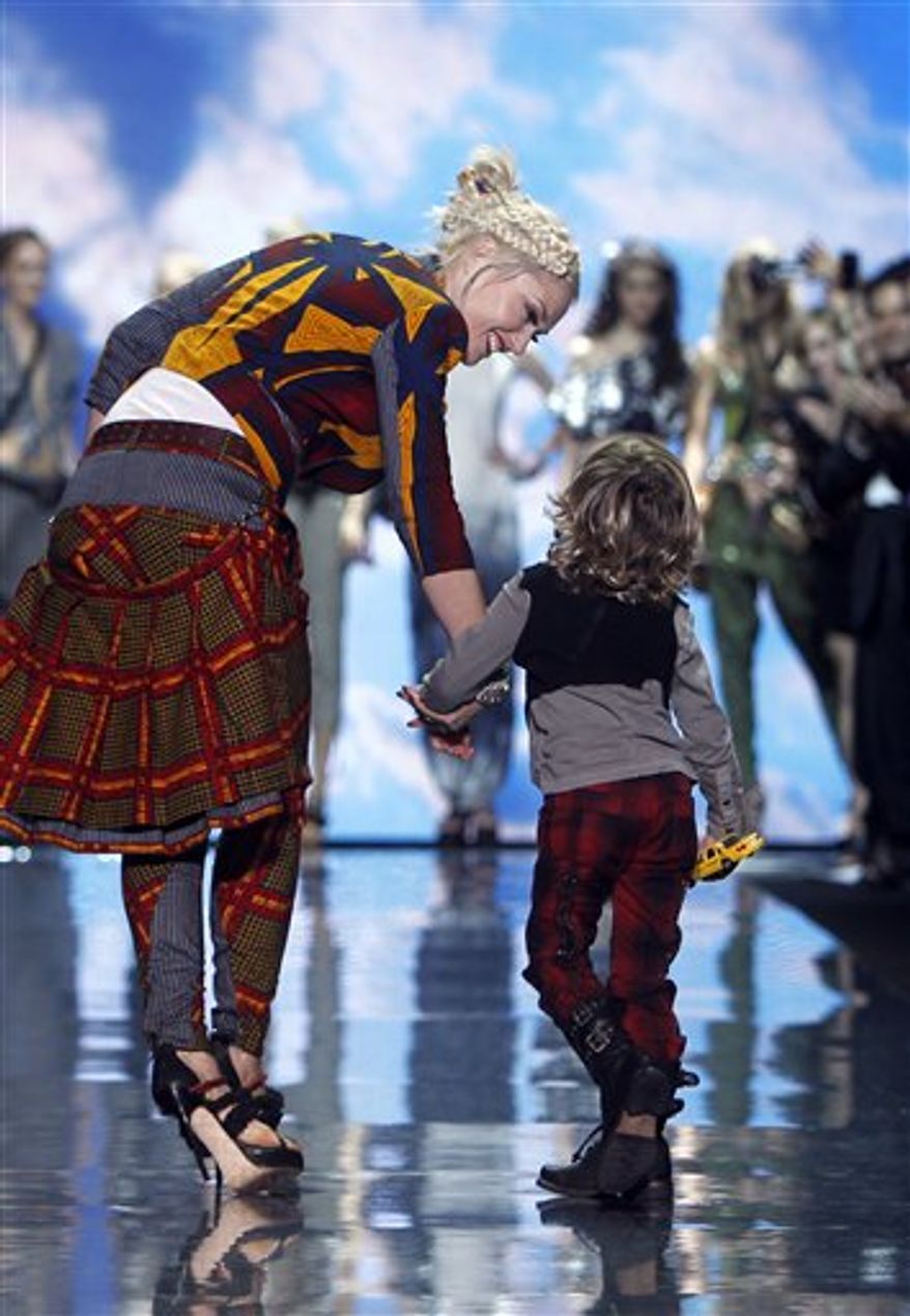 Designer Gwen Stefani acknowledges the audience after the L.A.M.B. spring 2011 collection show Thursday, Sept. 16, 2010, during Fashion Week in New York. (AP Photo/Jason DeCrow)