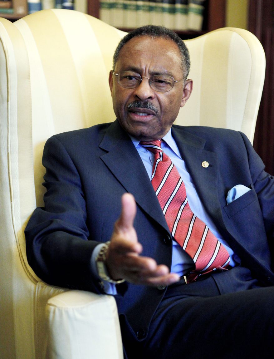 Sen. Roland W. Burris, Illinois Democrat, is offering an amendment to the Defense Authorization Act that would lift restrictions on abortions at military hospitals. The Senate votes Tuesday. (AP Photo)