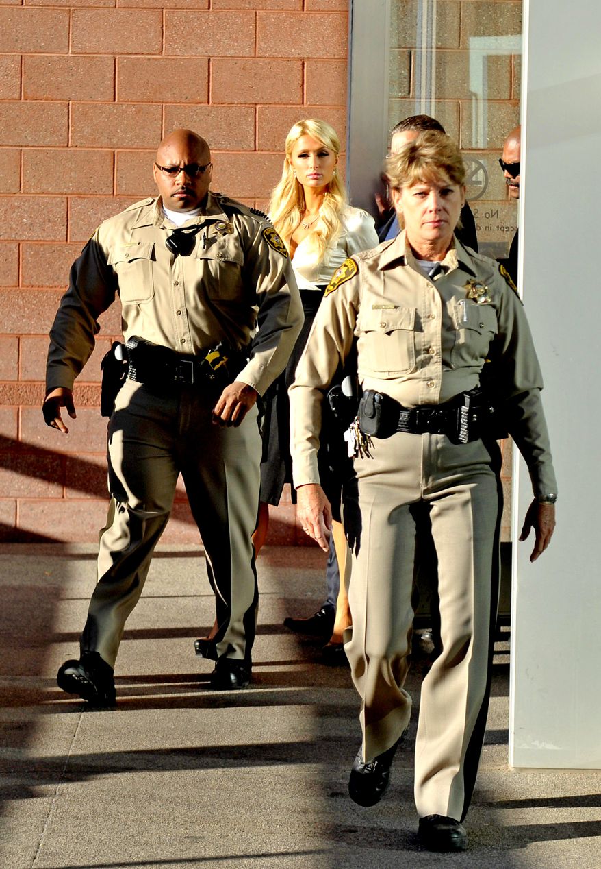 Socialite Paris Hilton leaves the Clark County Regional Justice Center in Las Vegas, Nev. on Monday, Sept. 20, 2010. Hilton pleaded guilty to two misdemeanor charges stemming from her arrest last month at a Las Vegas hotel-casino. She will serve a year of probation and avoid a felony charge under the terms of a plea deal worked out with prosecutors. (AP Photo/Mark Damon)