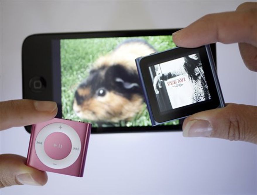 Shown are new Apple iPods from left, the Shuffle, Touch and Nano in San Francisco, Wednesday, Sept. 22, 2010. (AP Photo/Eric Risberg)