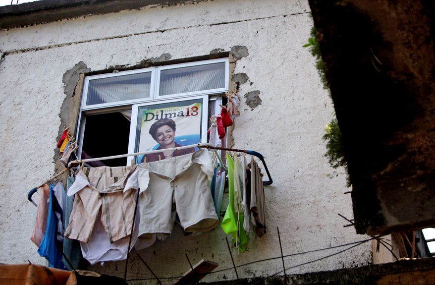 A Rousseff poster hangs above the laundry at a home in Rio de Janeiro's Pavao-Pavaozinho slum. Mrs. Rousseff's quick rise is a testament to the popularity of her mentor, Mr. da Silva. (Associated Press)
