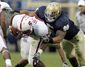Notre_Dame_Te_o_s_Tackles_Football.sff.jpg