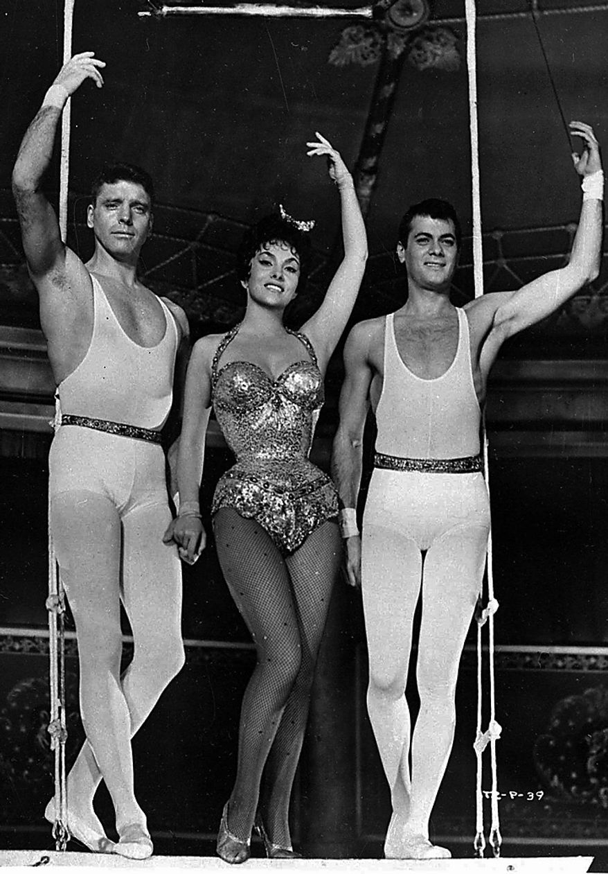 Burt Lancaster, Gina Lollobrigida and Tony Curtis, right, appear in a scene from the 1956 film "Trapeze," which premiered in Beverly Hills, Calif. Curtis has died at 85 according to the Clark County, Nev. coroner.(AP Photo/Files)