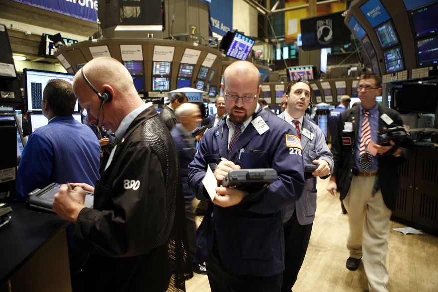 Traders and specialists work the trading floor of the New York Stock Exchange after the start of trading, Wednesday, Sept. 1, 2010, in New York. (AP Photo/David Karp)