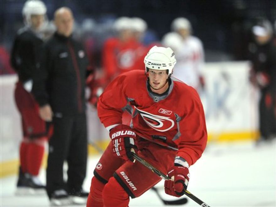 Carolina Hurricanes Tuomo Ruutu of Finland skates during the NHL ice hockey team's practice session in Helsinki, Finland, on Tuesday Oct. 5, 2010, ahead of Thursday's NHL opener game against Minnesota Wild. (AP Photo/Lehtikuva / Pekka Sakki)
