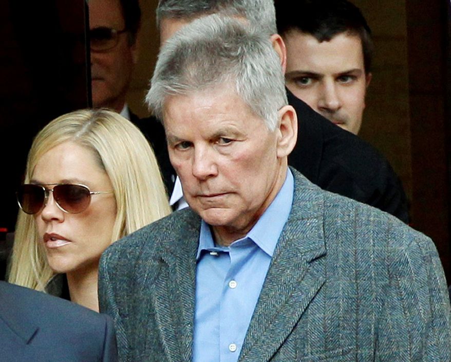 ** FILE ** Former Rep. Gary A. Condit leaves court after testifying in the Chandra Levy murder trial. He refused to answer whether the two had an affair. (Associated Press)