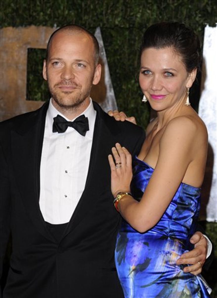 FILE - In this March 7, 2010 file photo, Peter Sarsgaard, left, and Maggie Gyllenhaal arrive at the Vanity Fair Oscar party in West Hollywood, Calif. (AP Photo/Peter Kramer, file)
