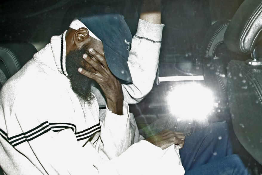 Binyam Mohamed, 30, foreground, a British resident freed from Guantanamo Bay prison returns to Britain a free man in this file photo dated Monday Feb. 23, 2009, as he leaves RAF Northolt in west London, after nearly seven years in U.S. captivity. After months of legal wrangling, Tuesday Nov. 16, 2010, the British government has agreed to pay hefty settlements to a group of former Guantanamo Bay detainees, including Binyam Mohamed, who together sued the government for alleged complicity in their torture, one of the first big pay-outs stemming from the US-led war on terrorism. (AP Photo/Sang Tan, FILE)