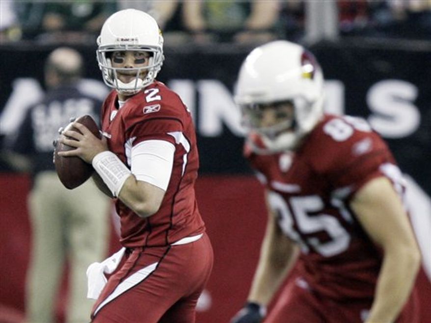 FILE- In this Jan. 3, 2010, file photo, Arizona Cardinals quarterback Brian St. Pierre (2) drops back to pass against the Green Bay Packers during the second half on an NFL football game in Glendale, Ariz. St. Pierre has thrown five passes in eight NFL seasons. On Sunday, he'll start for the Carolina Panthers, who signed him to the practice squad last week. He was promoted to the 53-man roster on Tuesday, after injuries to QBs Matt Moore and Jimmy Clausen.(AP Photo/Paul Connors, File)