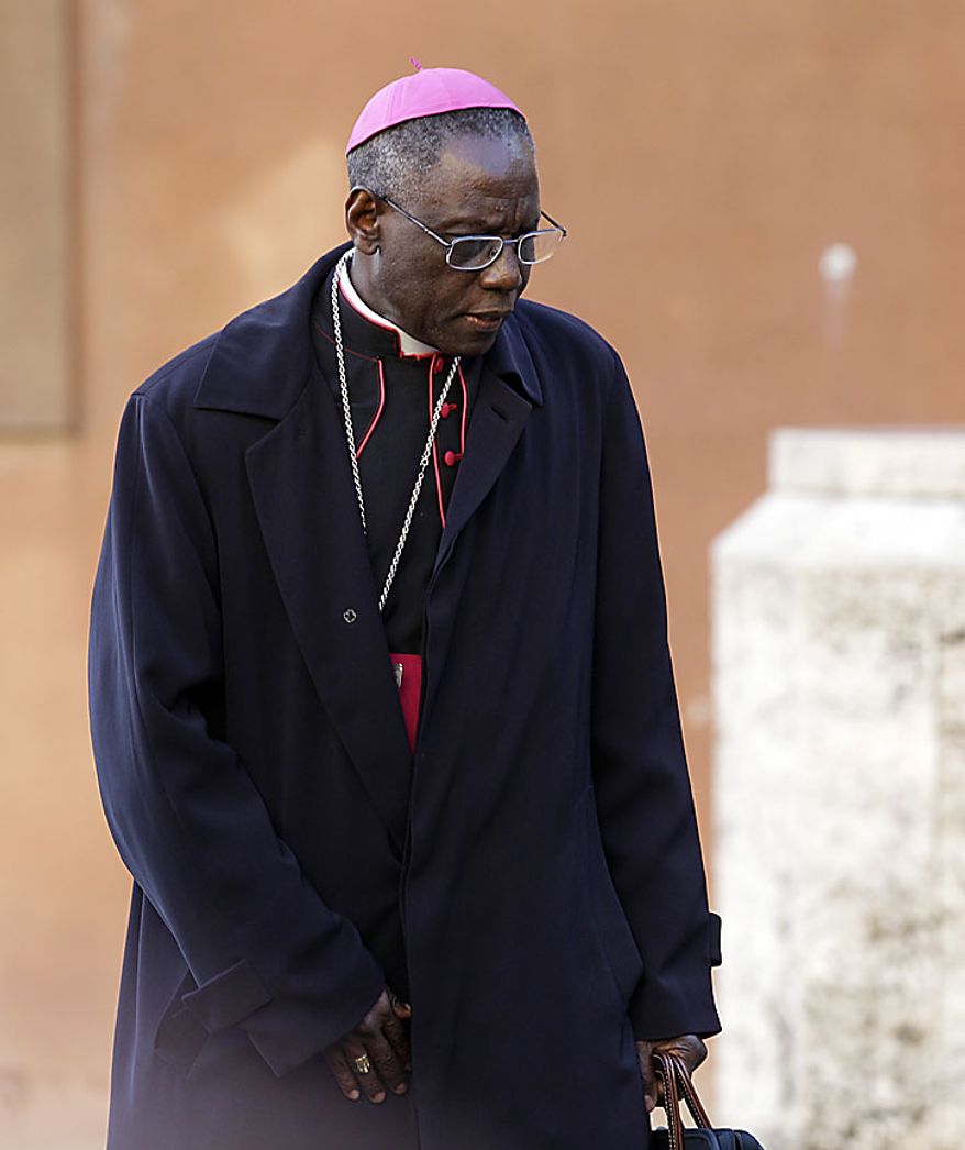 President of the Pontifical Council "Cor Unum" Archbishop Robert Sarah, of Guinea arrives to attend a meeting of cardinals summoned by Pope Benedict XVI for a day of reflection at the Vatican, Friday, Nov. 19, 2010, the day before a ceremony to create 24 new cardinals including Archbishop Robert Sarah who is scheduled to to elevated to cardinal. The top agenda, religious freedom, grew remarkably timely given China's planned ordination Saturday of a bishop who doesn't have the Pope's approval. The Vatican warned China that efforts at reconciliation would be set back if bishops loyal to the pope were forced to attend the ordination. The Vatican said such actions would constitute "grave violations of freedom of religion and freedom of conscience.'' (AP Photo/Alessandra Tarantino) (AP Photo/Alessandra Tarantino)