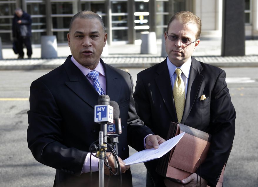 Fernando Mateo, left, the president of Hispanics Across America, and attorney Kevin Faga announce in New York on Monday, Nov. 22, 2010, that the estate of an Ecuadorean immigrant killed in a 2008 confrontation with a mob of teens in in Patchogue, Long Island has filed a $40 million federal civil rights lawsuit. Hate crimes reported last year by police agencies nationwide were down by 15 percent compared to 2008 and hit their lowest point in 15 years, the FBI said Monday. (AP Photo/Seth Wenig)