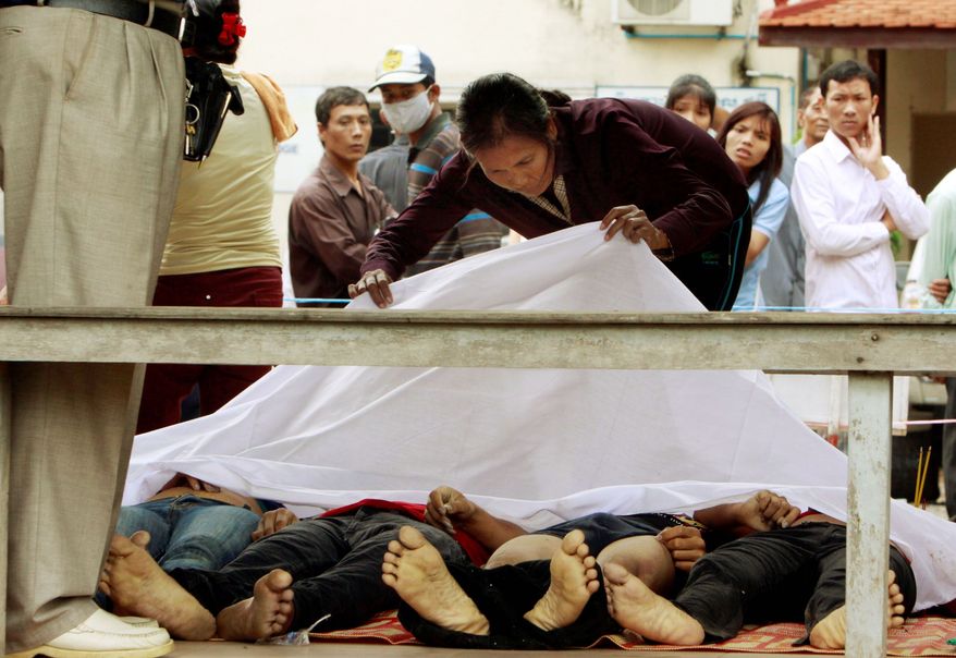 A Cambodian woman looks for her missing relative at Preah Kossamak Hospital in Phnom Penh on Tuesday. The prime minister called the disaster the country's biggest tragedy since the 1970s reign of terror by the Khmer Rouge. (Associated Press)